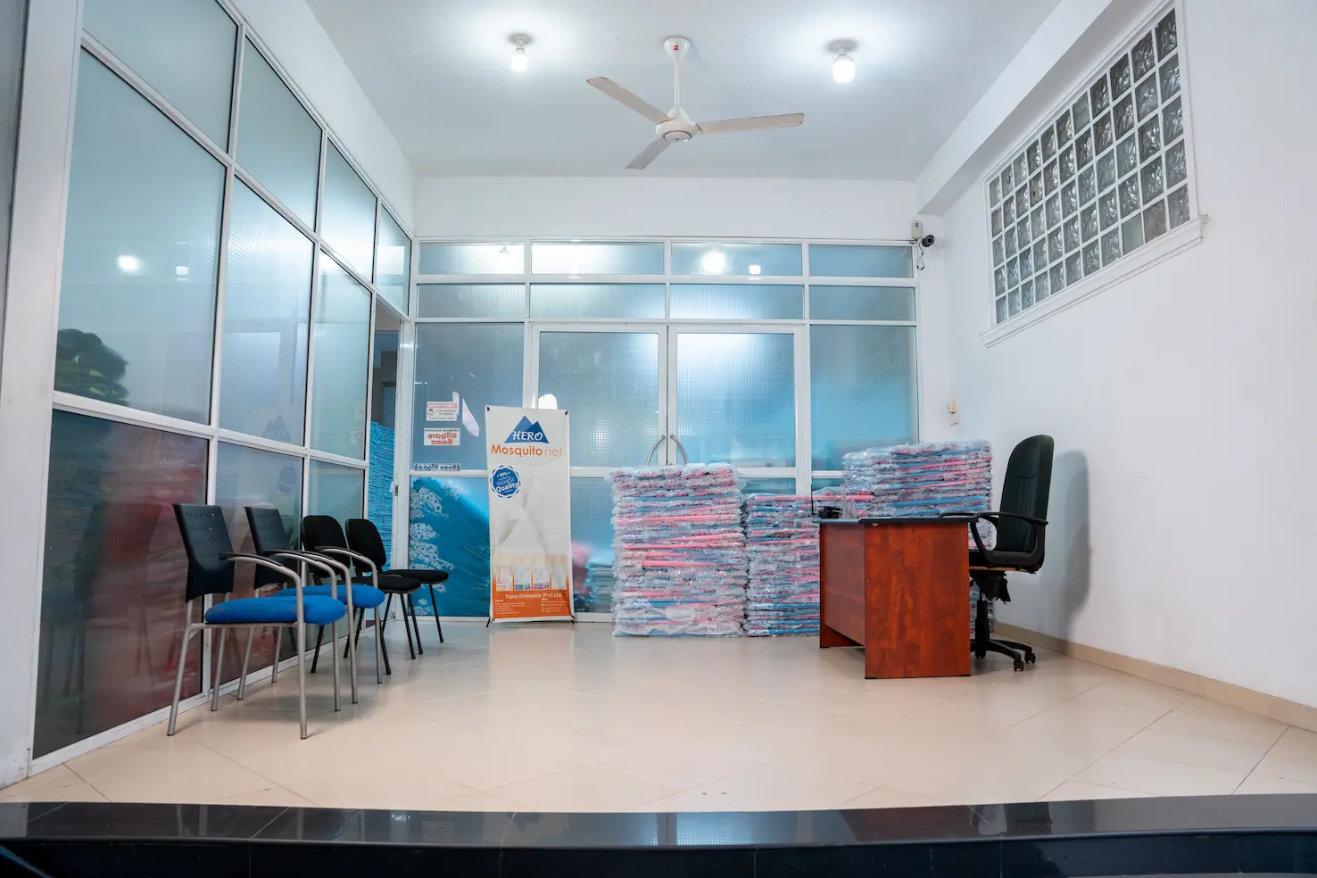 The Hero Mosquito Nets showroom, with packed nets stacked ready for dispatch